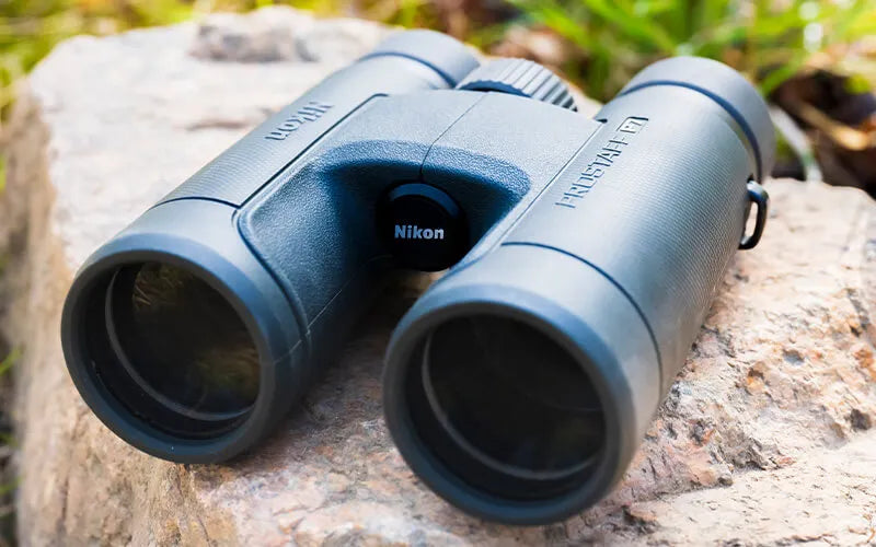 Nikon Prostaff P7 binoculars perched on a large rock outlying the hard body feature.