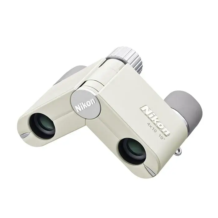 Top left view of Nikon 4x10 CF Binoculars showcasing their 90° fold feature in Ivory on a white background with grey eye cups.