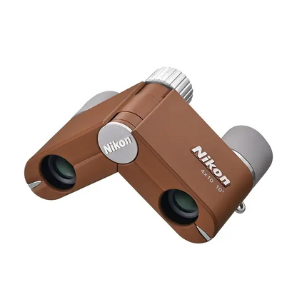 Top right view of Nikon 4x10 CF Binoculars in brown on a white background with grey eye cups.