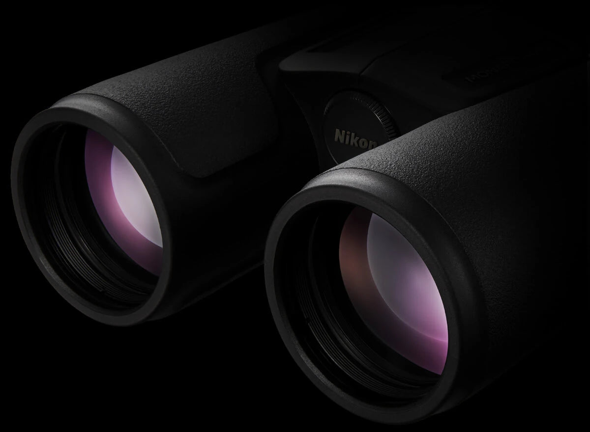 Nikon binoculars close-i[ of objective lens highlighting the ED Glass feature.