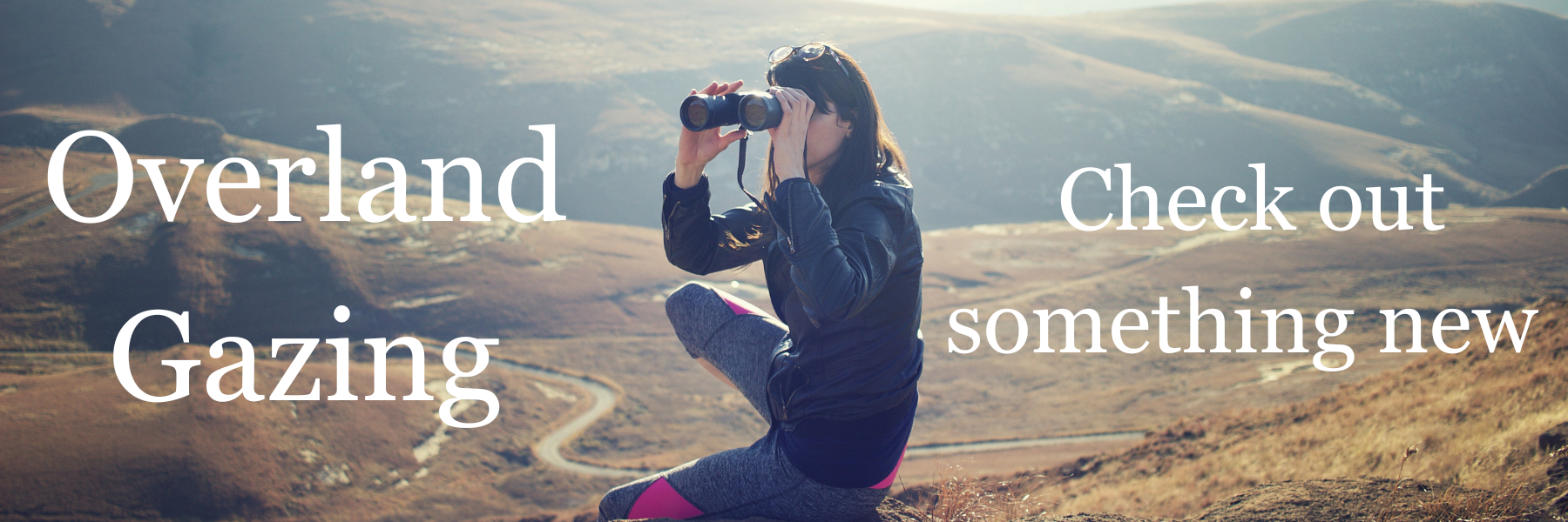 Person using binoculars to look at a scenic landscape with text overlay.
