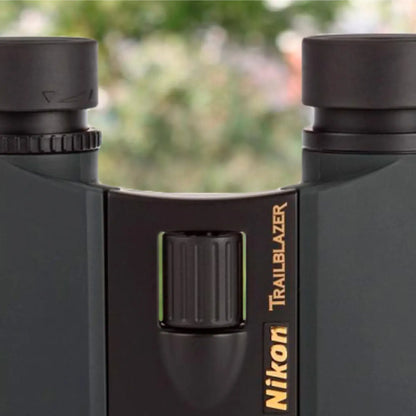 Nikon Trailblazer binoculars with a blurred natural background