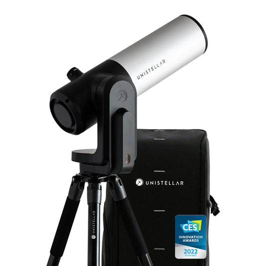 Unistellar telescope with carrying case on a white background